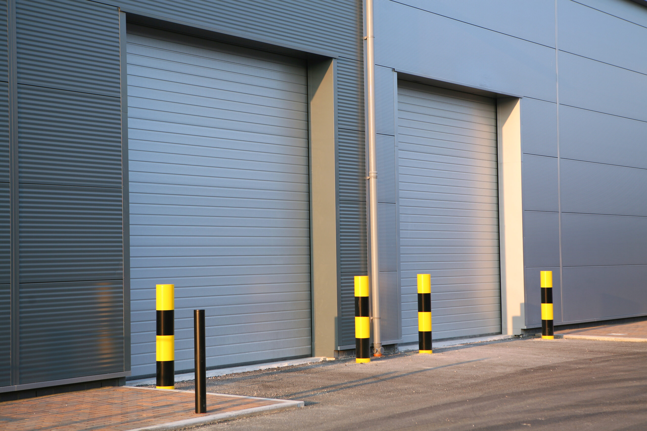 Industrial units with commercial shutters.
